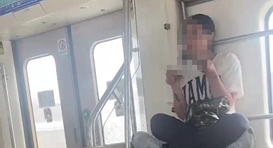 Yolculara aldırmadan İZBAN'da uyuşturucu kullandı